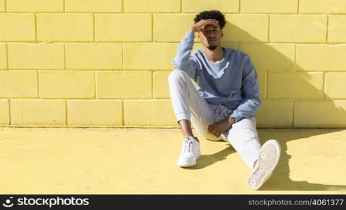 young man outdoor sitting 2