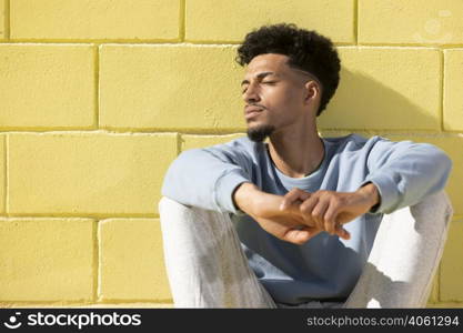 young man outdoor sitting