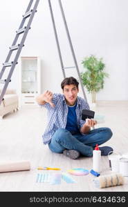 Young man overspending his budget in refurbishment project