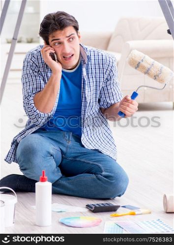 Young man overspending his budget in refurbishment project. The young man overspending his budget in refurbishment project