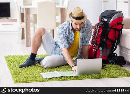 Young man planning his travel online