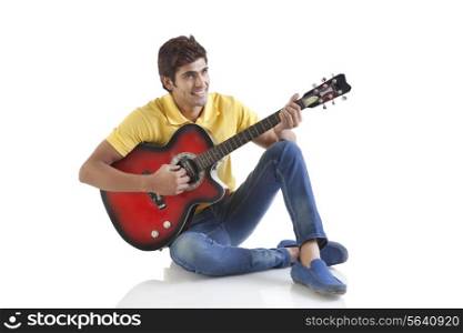 Young man playing a guitar