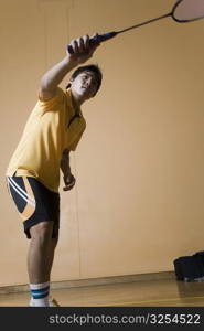 Young man playing badminton