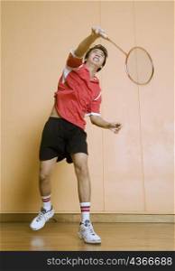 Young man playing badminton