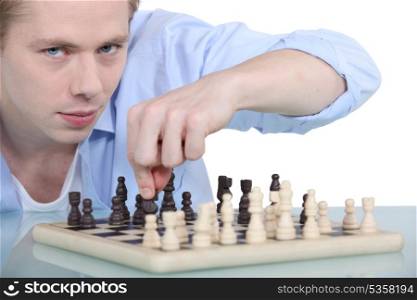 young man playing chess