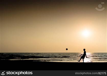 Young man playing football silhouette ocean horizon sunset horizontal illustration. Young man playing football silhouette ocean horizon sunset horiz