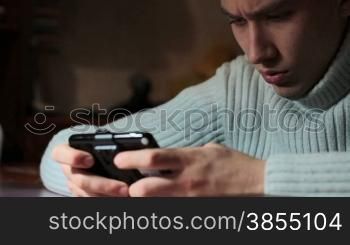 young man playing on console. video shot slider DITOGEAR.