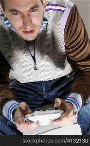 Young man playing video game