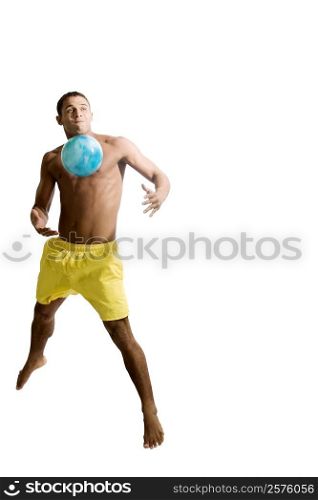 Young man playing with a ball