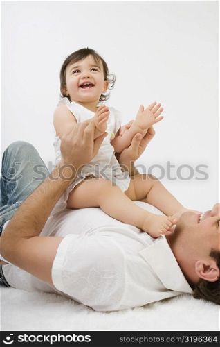 Young man playing with his daughter