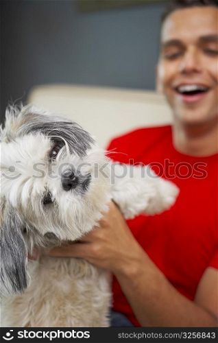 Young man playing with his pets