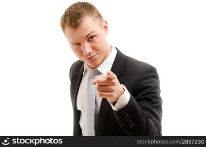 Young man pointing at camera. Isolated on white.