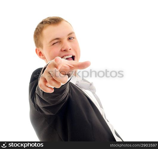 Young man pointing at camera. Isolated on white.