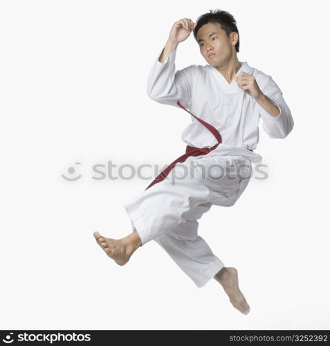 Young man posing in mid-air