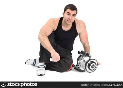 young man posing with dumbbells sitting on floor, on white background