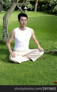Young man practising Qigong