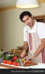Young man preparing a healthy meal to eat