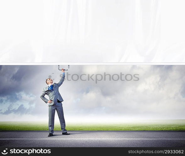 Young man pulling banner