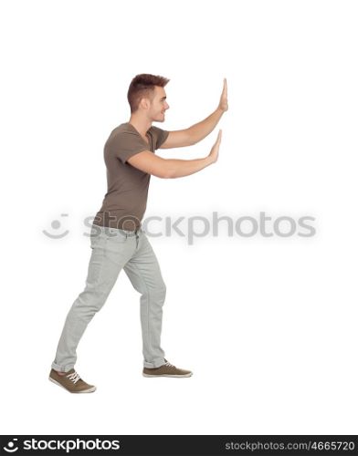 Young man pushing something isolated on a white background
