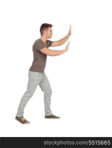Young man pushing something isolated on a white background