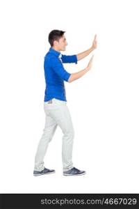 Young man pushing with blue shirt isolated on white background