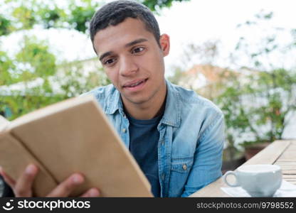 young man reading a book