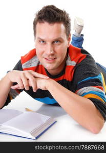 young man reading a book or studying on the floor isolated on white