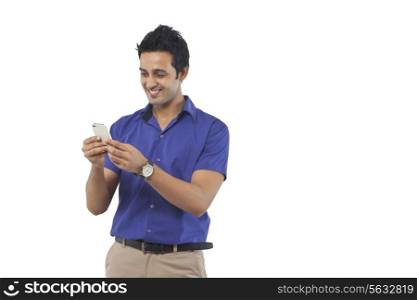 Young man reading an sms on a mobile phone