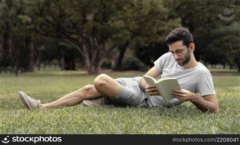 young man reading interesting book