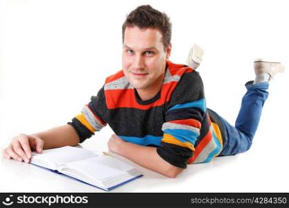 young man reading or studying on the floor full length isolated on white