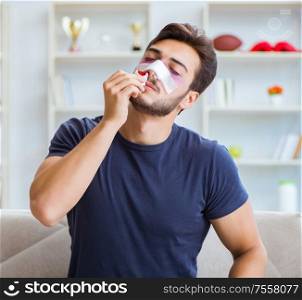 Young man recovering healing at home after plastic surgery nose job. Young man recovering healing at home after plastic surgery nose