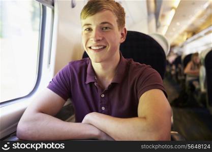 Young Man Relaxing On Train Journey