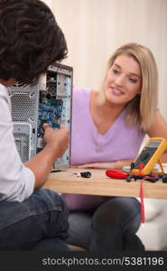 young man repairing a computer