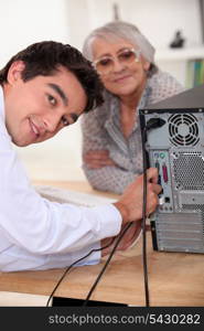 young man repairing a computer