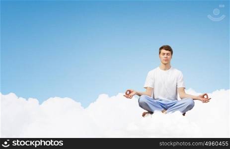 Young man representing soul balance and meditation concept. Recreation and relax