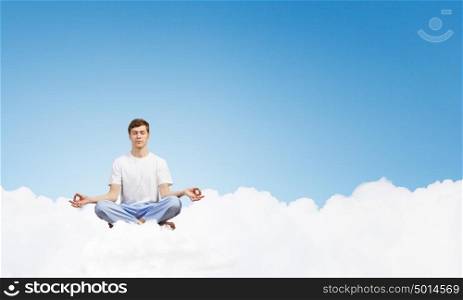 Young man representing soul balance and meditation concept. Recreation and relax