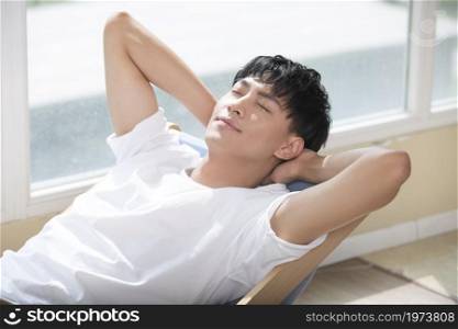 Young man restingon the recliner