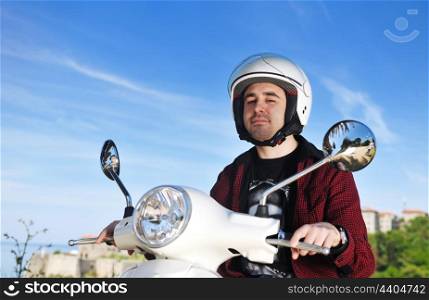 young man ride white retro vintage motorbike scooter