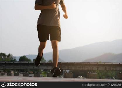 Young man runner feet running on the road be running for exercise. healthy exercise concept.