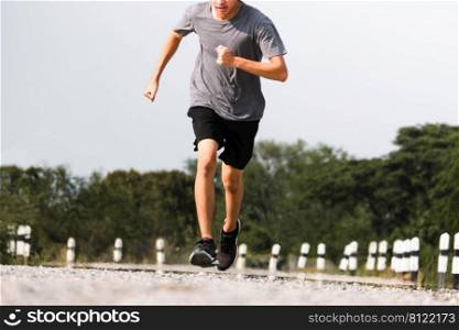 Young man runner feet running on the road be running for exercise. healthy exercise concept.