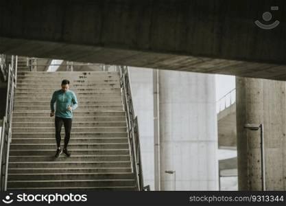 Young man running fast down the stairs in the city