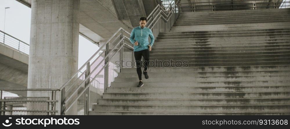 Young man running fast outdoors in the city
