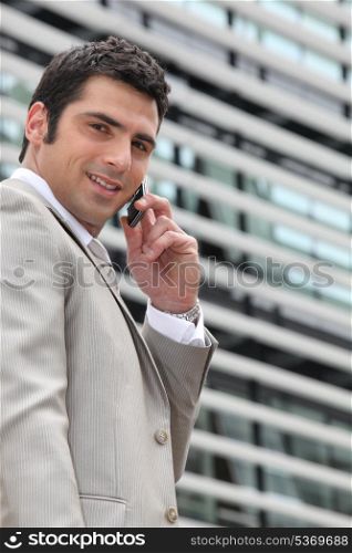 Young man setting an appointment on phone