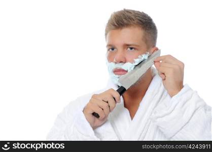 Young man shaving in the morning close-up. Isolated on a white background