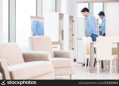 Young man shopping in furniture store