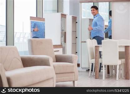 Young man shopping in furniture store