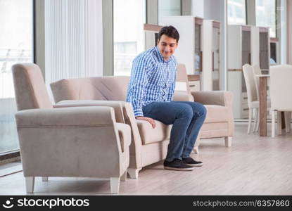 Young man shopping in furniture store