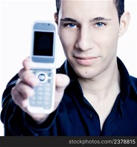 Young man showing a cell phone, toned in PS