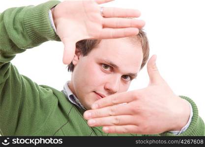 Young man showing framing hand gesture on an isolated background