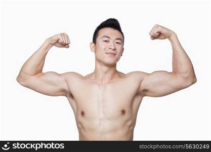 Young man showing off biceps